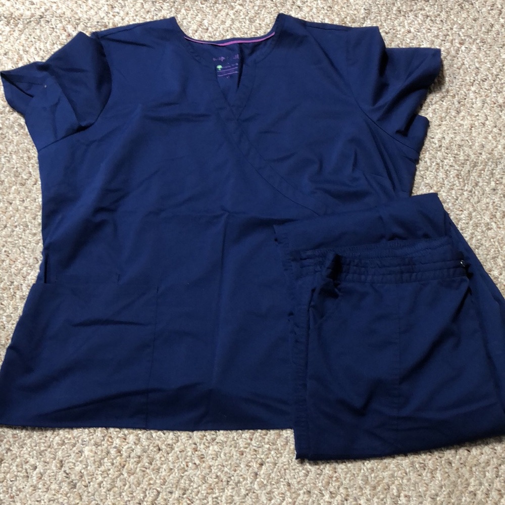 4 sets of navy blue healing hands- purple label scrubs. 2x womens